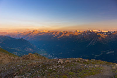 Scenic view of mountains against sky during sunset