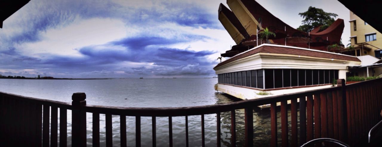 building exterior, architecture, sky, built structure, cloud - sky, water, sea, cloud, house, cloudy, railing, residential structure, outdoors, nature, balcony, no people, day, residential building, horizon over water, window