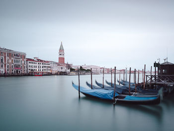 Boats moored at dock