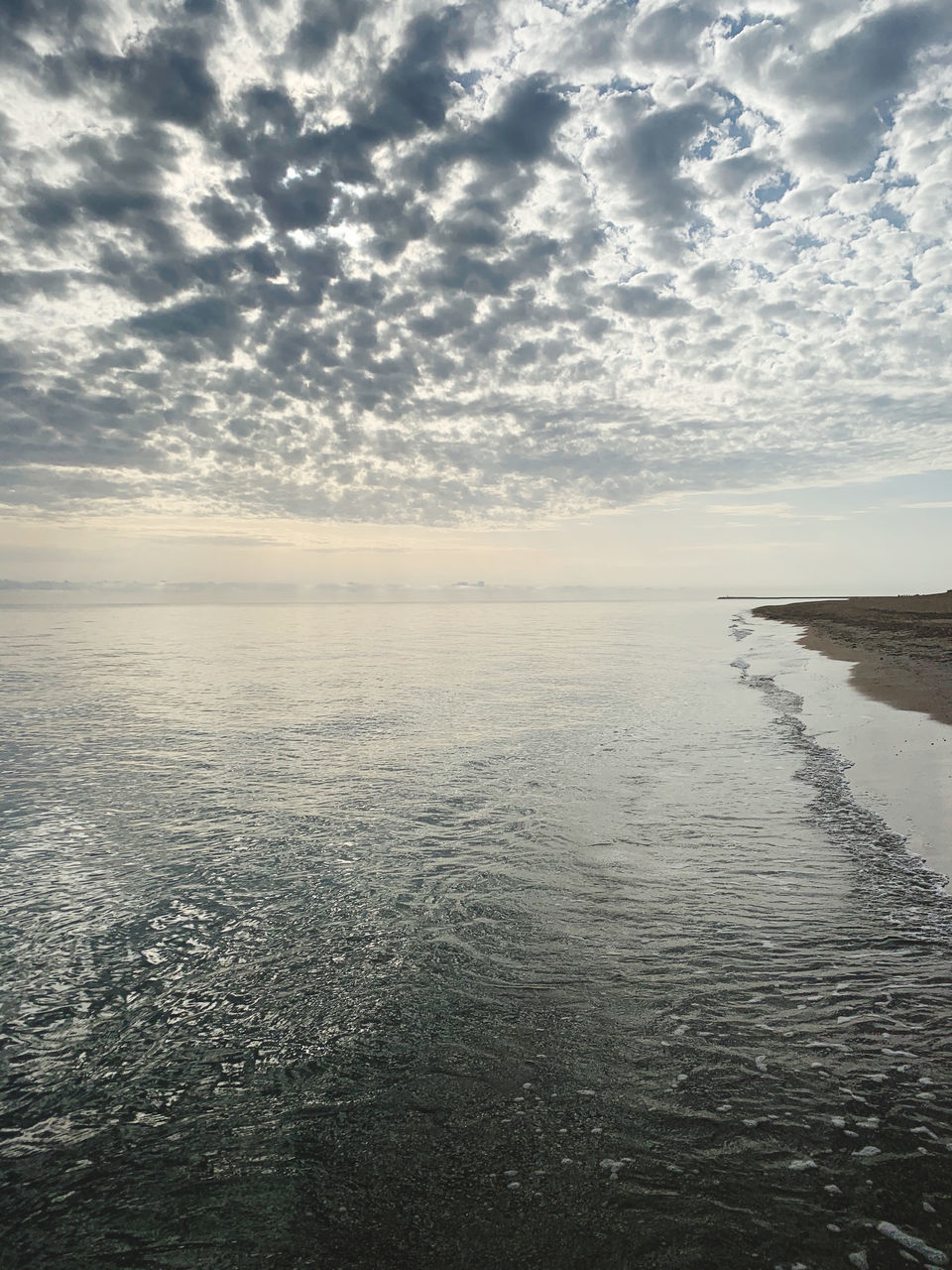 sky, water, horizon, cloud, sea, scenics - nature, beauty in nature, tranquility, ocean, nature, reflection, sunlight, tranquil scene, coast, shore, land, beach, horizon over water, no people, wave, body of water, environment, morning, outdoors, day, idyllic, dawn, seascape, landscape, non-urban scene