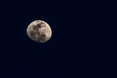 Low angle view of moon against sky at night