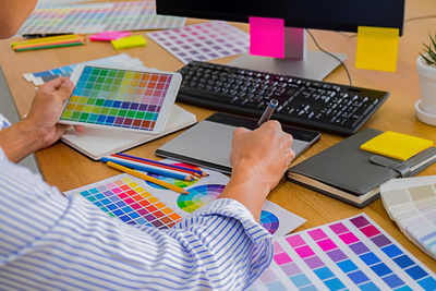 High angle view of person working on table