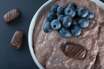 Traditional finnish foods - closeup of a bowl of chocolate porridge with blueberry topping