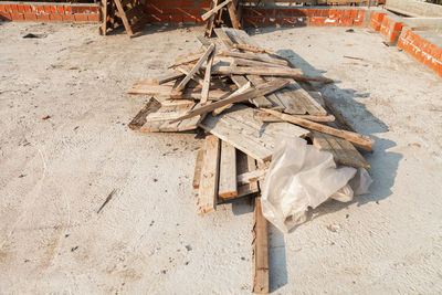 High angle view of garbage on sand at beach