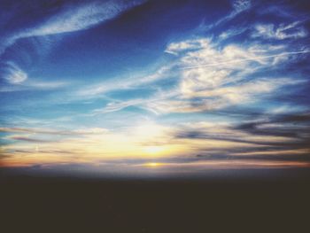 Scenic view of landscape against sky at sunset