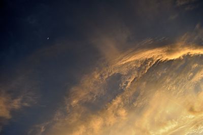 Low angle view of clouds in sky during sunset