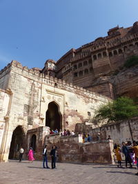 Group of people in front of historical building