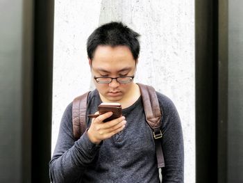 Young man using mobile phone