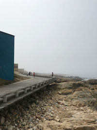 Scenic view of beach against clear sky