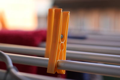 Close-up of yellow metal grate on window