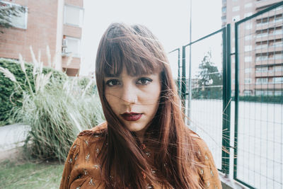 Close-up of young woman looking away