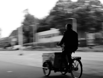 Blurred motion of people walking on road