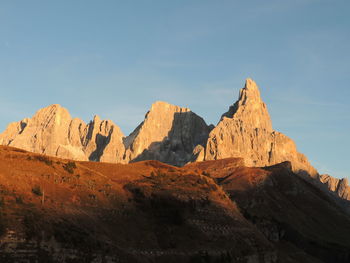 Scenic view of rocky mountains against clear blue sky