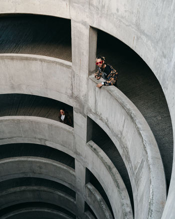 HIGH ANGLE VIEW OF PEOPLE ON VEHICLE