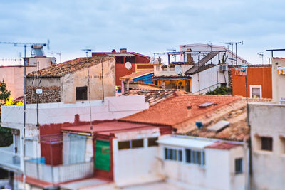 Buildings in city against sky