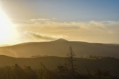 Scenic view of mountains against sky during sunset