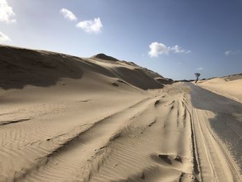 Panoramic view of desert against sky