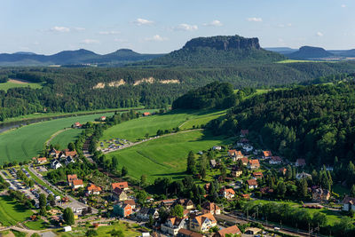 High angle view of trees and buildings against sky