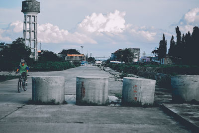 Street amidst buildings in city against sky