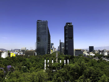 Modern buildings against clear sky in city