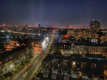 High angle view of illuminated buildings in city at night