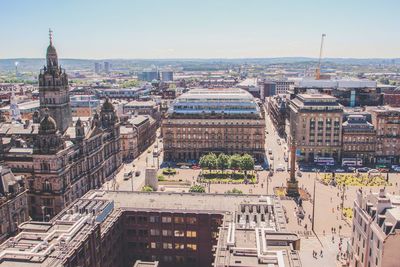 Aerial view of people and buildings in city