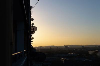 Low angle view of buildings against sky during sunset