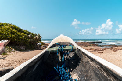 Fishing canoes moored in the sand on the beach. 