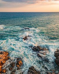 Scenic view of sea against sky during sunset