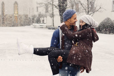 Young woman with ice cream in winter