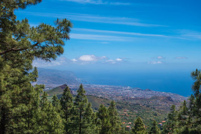 Scenic view of mountains against blue sky