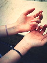 Close-up of hand holding cigarette