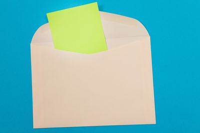Close-up of paper against blue background