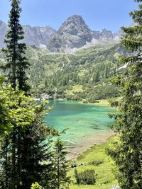 Scenic view of lake and mountains against sky