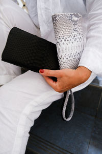 Midsection of man holding gift