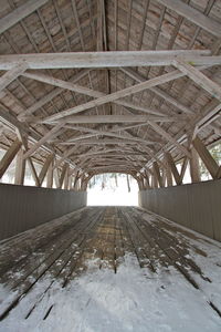 Full frame shot of covered bridge interior. wood post and beam construction 