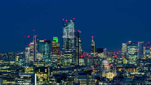 Illuminated buildings in city at night