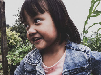 Portrait of smiling young woman looking away