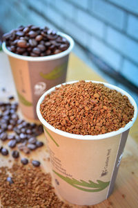 High angle view of coffee beans in glass on table