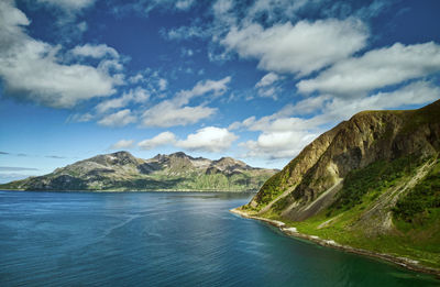 Scenic view of lake and mountains against sky