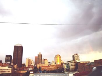 Modern buildings in city against sky