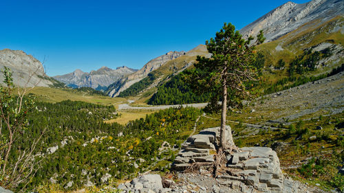 Scenic view of mountains against blue sky