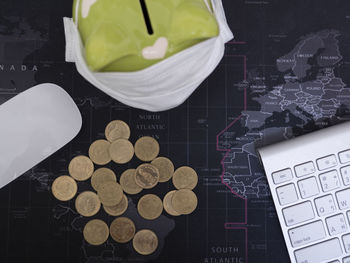High angle view of coins on table