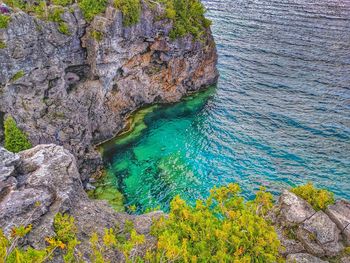 High angle view of rock formation in sea