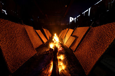 Low angle view of illuminated fire at night