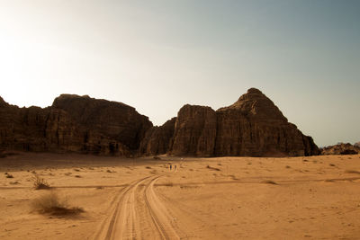 Scenic view of desert against clear sky