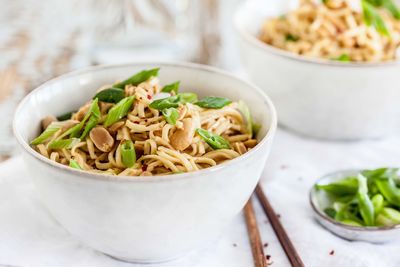 Close-up of fried noodles in bowl on table