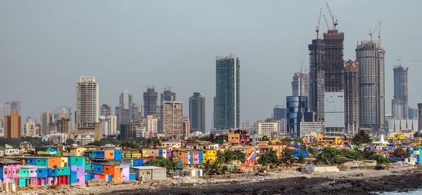 Modern buildings against sky in city