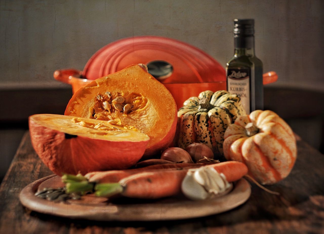 CLOSE-UP VIEW OF PUMPKIN ON TABLE AT HOME