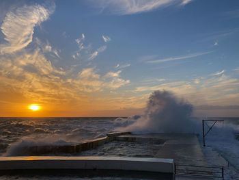 Scenic view of sea against sky during sunset